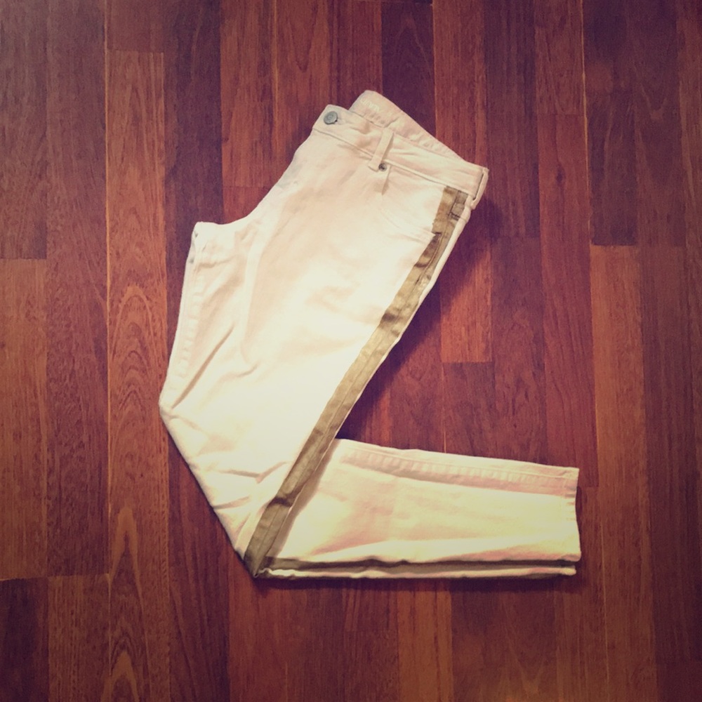 white jeans with a gold stripe on the side